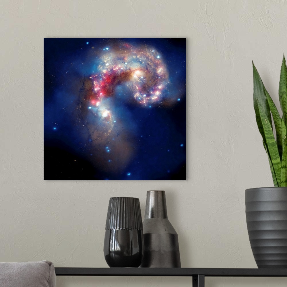A modern room featuring Composite image of two colliding galaxies, known as the Antennae galaxies, or NGC 4038 and NGC 40...