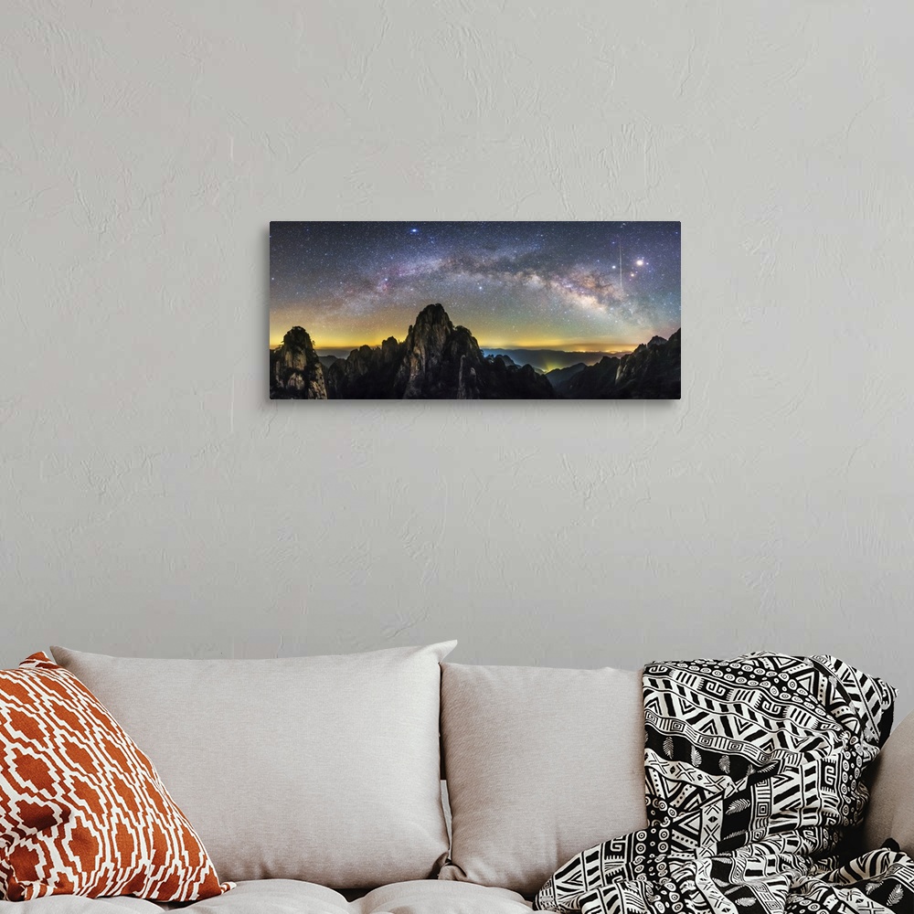 A bohemian room featuring The arc of the Milky Way and a bright streaking meteor , Mount Huangshan, China.