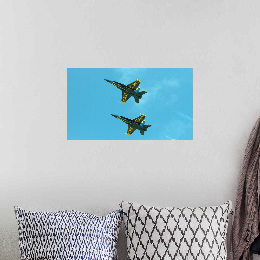 A bohemian room featuring The Blue Angels perform aerial demonstrations during an air show