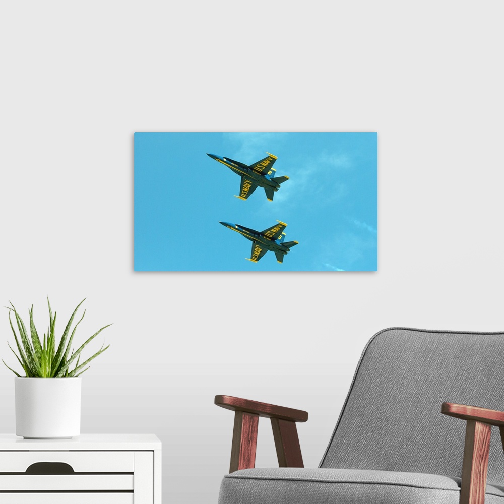 A modern room featuring The Blue Angels perform aerial demonstrations during an air show