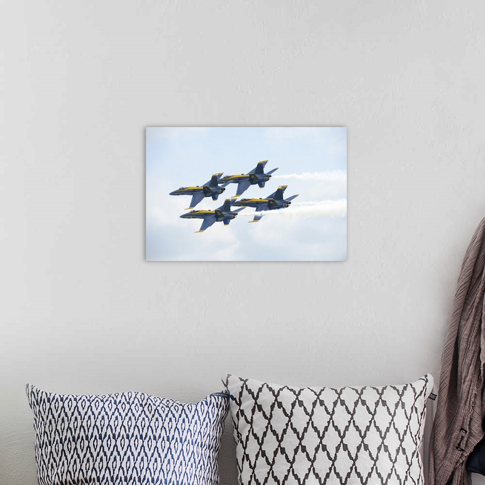 A bohemian room featuring The Blue Angels perform the Diamond 360 maneuver.