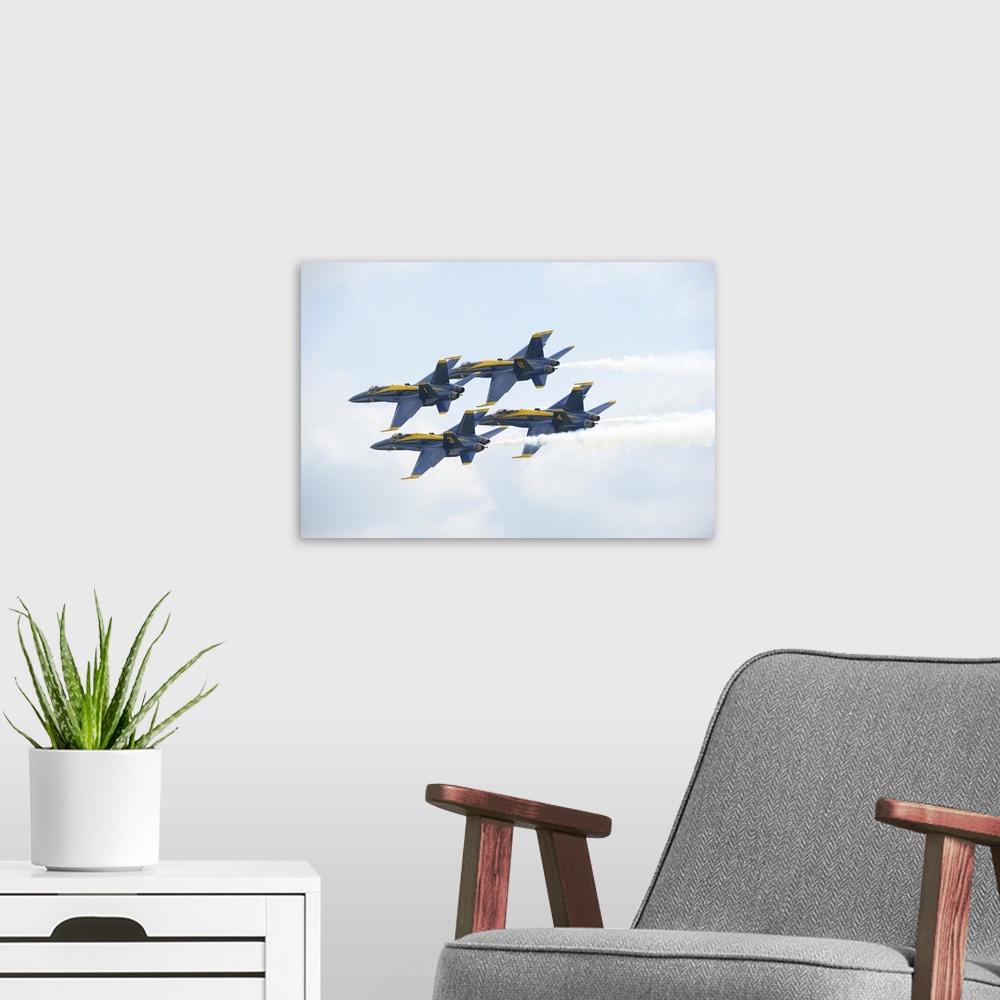 A modern room featuring The Blue Angels perform the Diamond 360 maneuver.