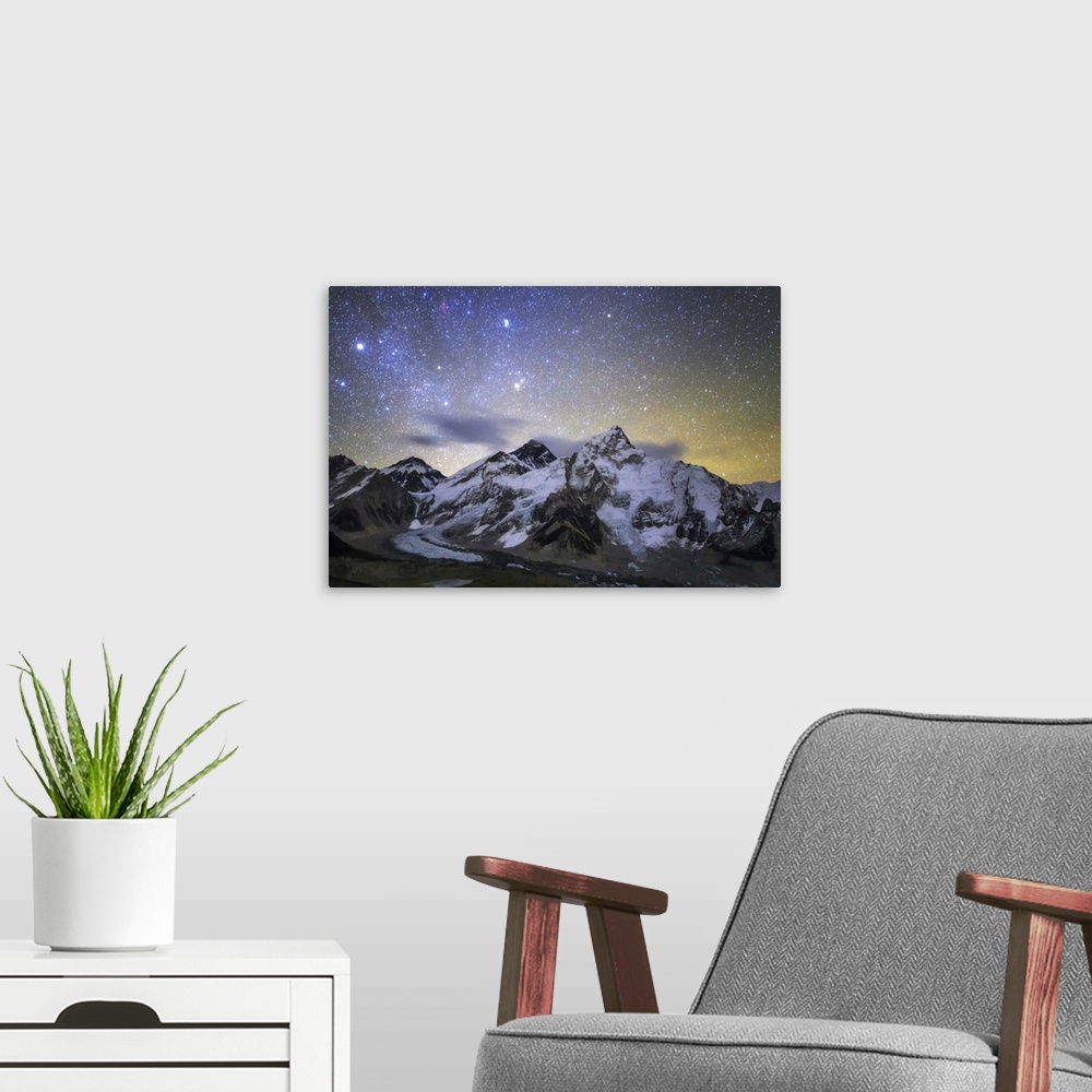 A modern room featuring The bright stars of constellation Auriga and Taurus rise above the central Himalayas. Mount Evere...