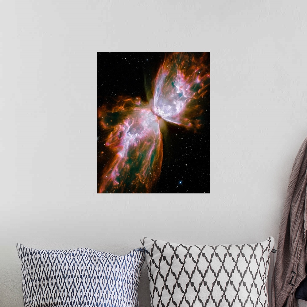 A bohemian room featuring Photograph of interstellar cloud of dust, hydrogen, and helium that is shaped like a winged insec...