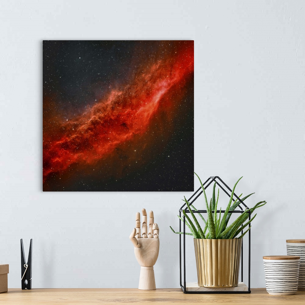 A bohemian room featuring True color image of NGC 1499, The California Nebula.