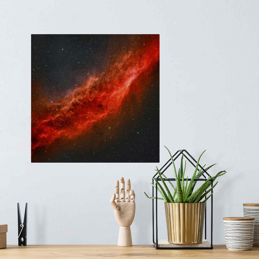 A bohemian room featuring True color image of NGC 1499, The California Nebula.