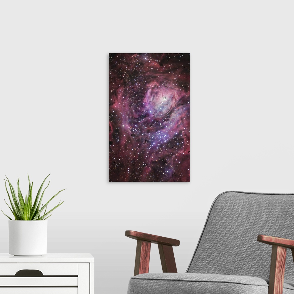 A modern room featuring The central region of the Lagoon Nebula, which is also known as Messier 8, in the constellation o...