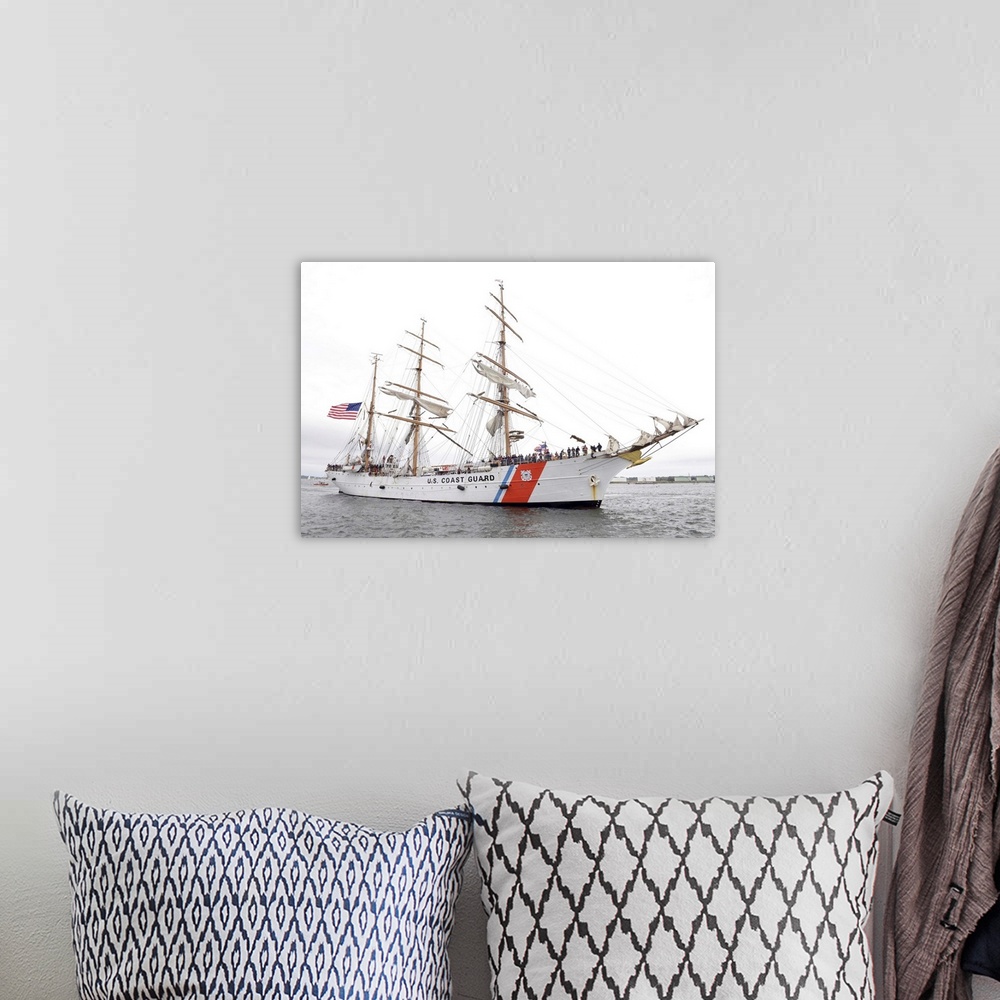 A bohemian room featuring The Coast Guard Cutter Eagle is preparing to moor in Portland Harbor, Maine.