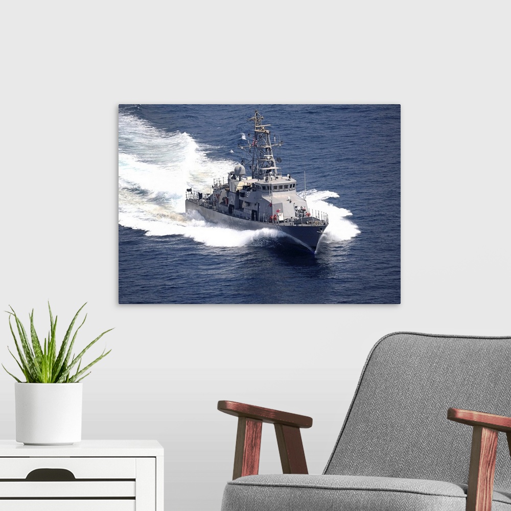 A modern room featuring The cyclone-class coastal patrol ship USS Firebolt transits the Arabian Gulf.