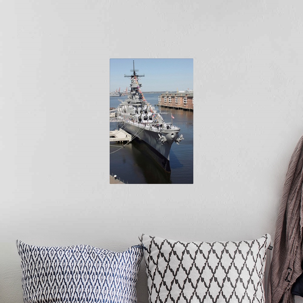 A bohemian room featuring The decommissioned US Navy Battleship USS Wisconsin berthed to the pier
