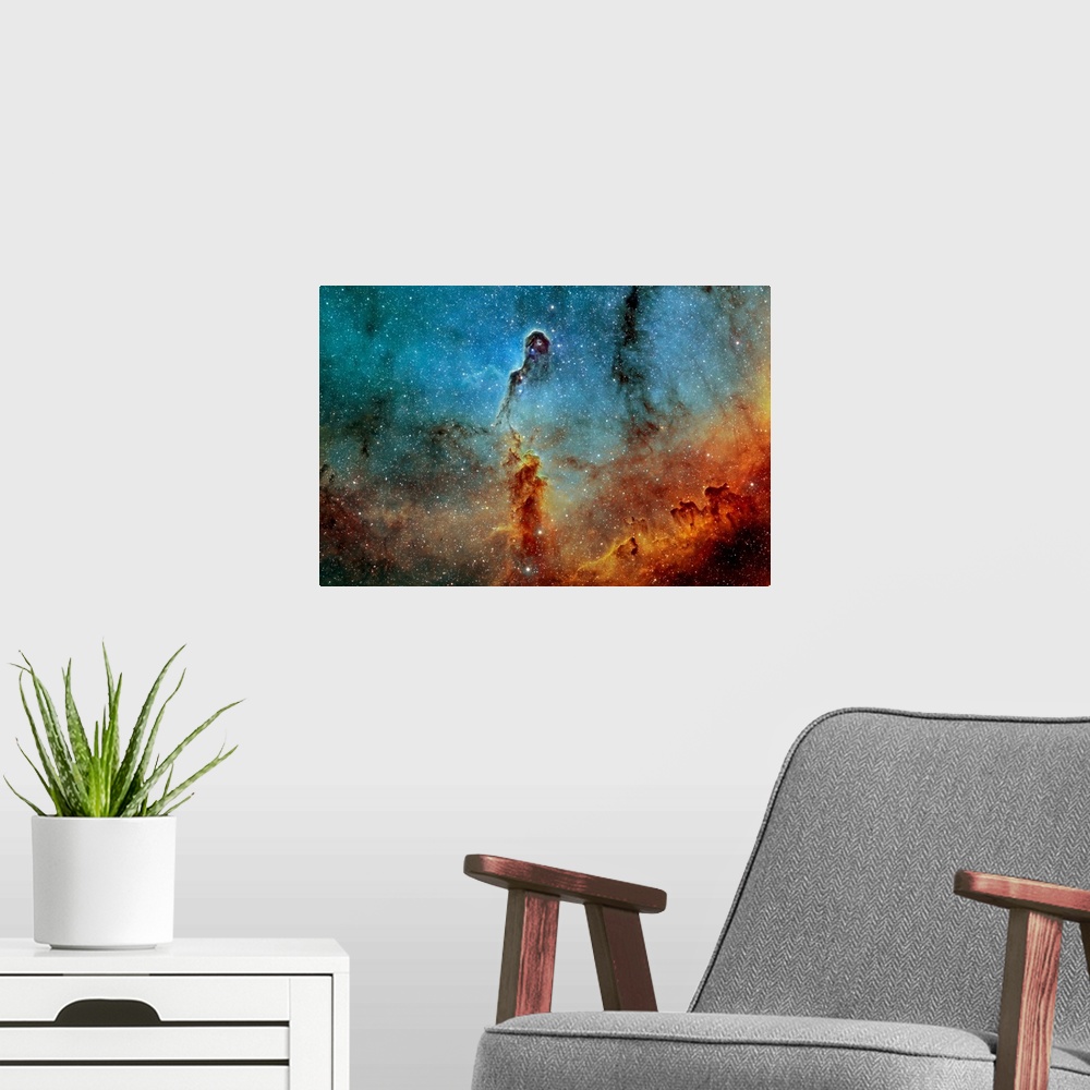 A modern room featuring Large photograph showcases a concentration of interstellar gas and dust within the much larger io...