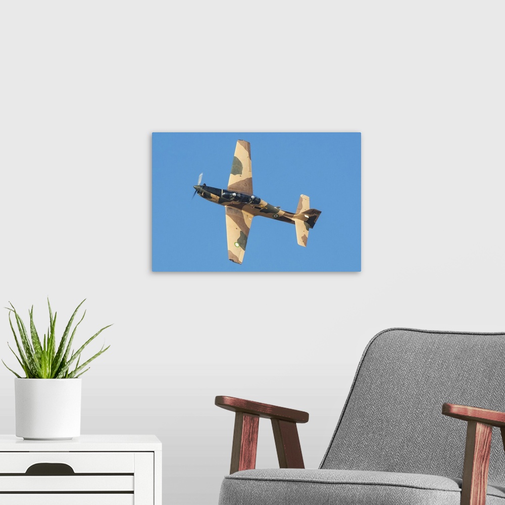 A modern room featuring The Embraer EMB 312 Tucano used by the Islamic Revolutionary Guard Corps.