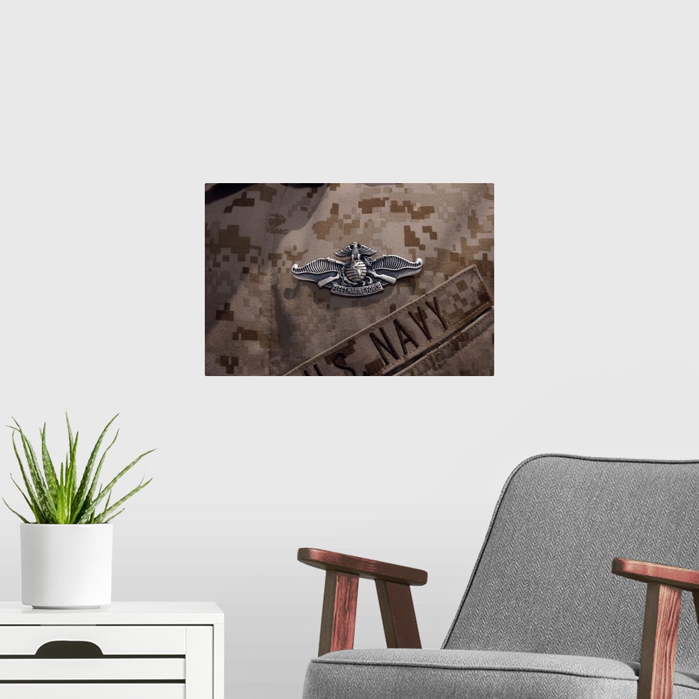 A modern room featuring The Enlisted Fleet Marine Force Warfare Specialist pin.