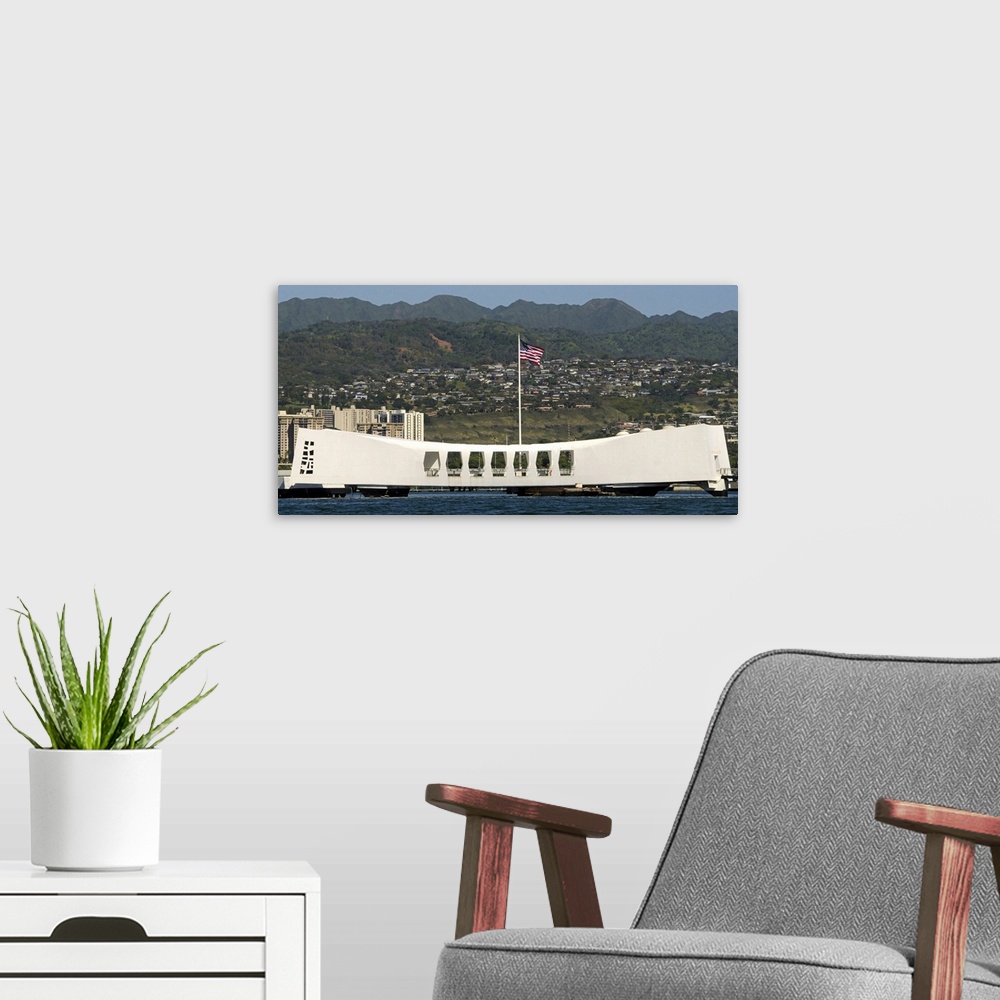 A modern room featuring The Ensign flies over the Arizona Memorial