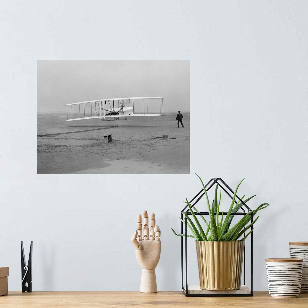 A bohemian room featuring The first flight of the Wright Flyer in 1903.