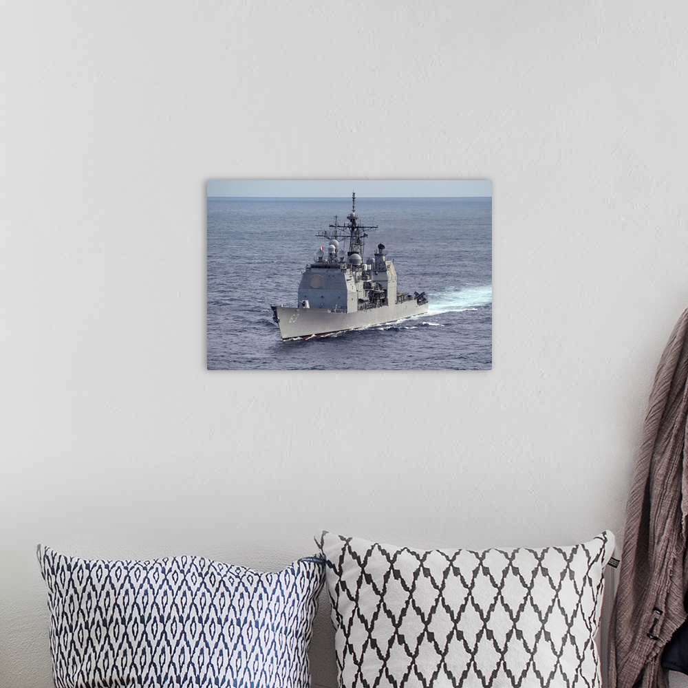 A bohemian room featuring The guided missile cruiser USS Cowpens.