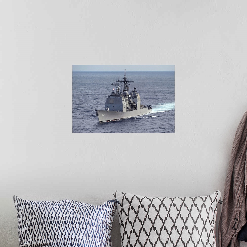 A bohemian room featuring The guided missile cruiser USS Cowpens.