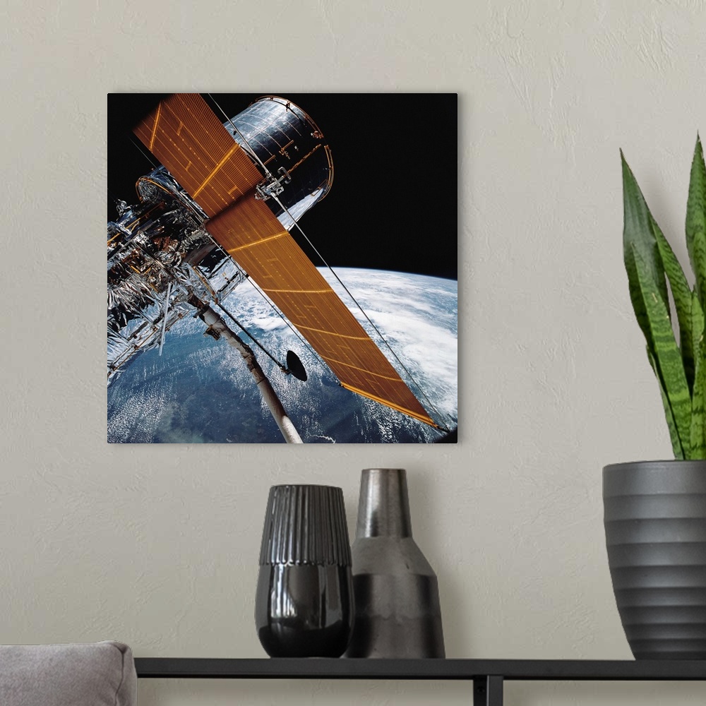 A modern room featuring April 25, 1990 - The Hubble Space Telescope backdropped by planet Earth.