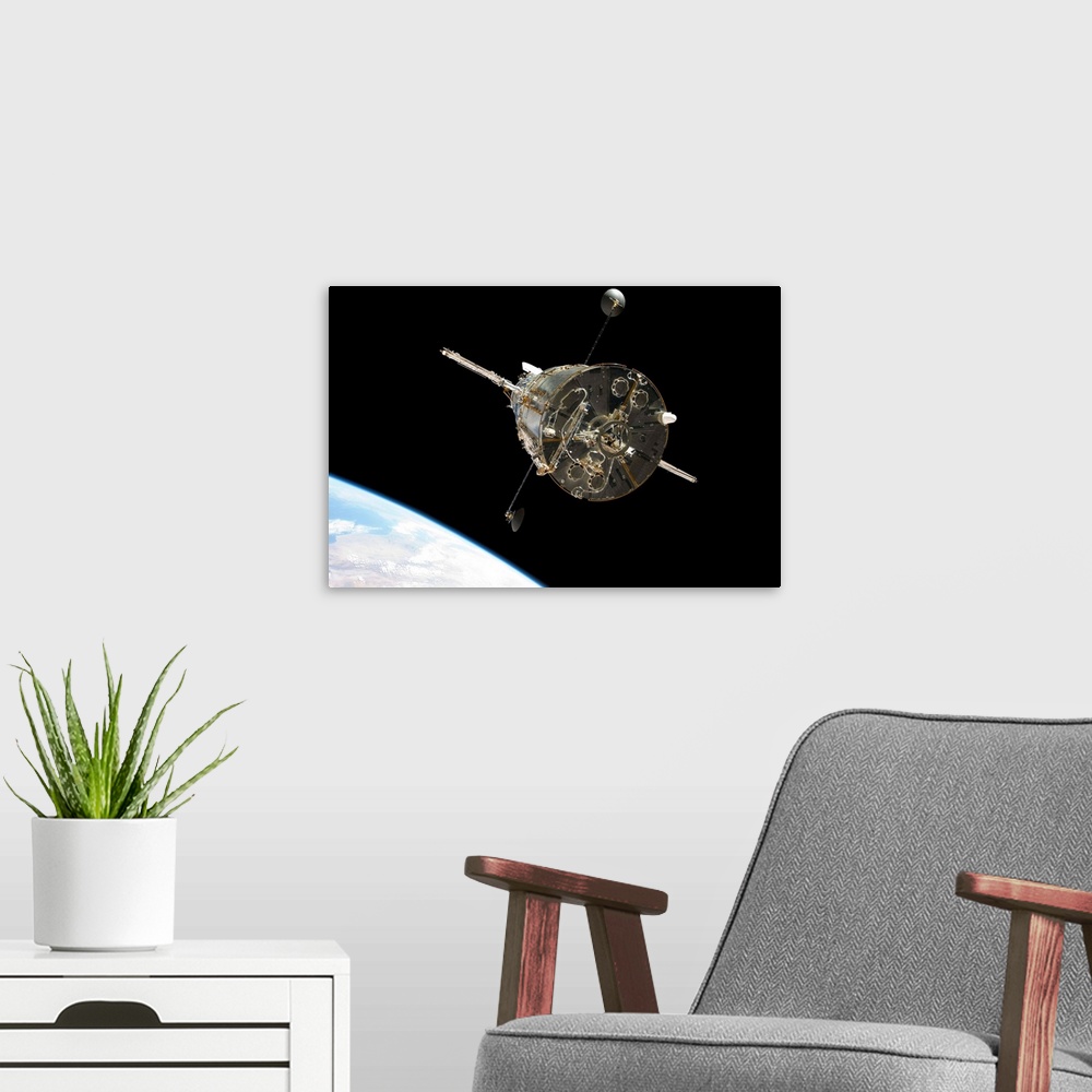 A modern room featuring The Hubble Space Telescope in orbit above Earth