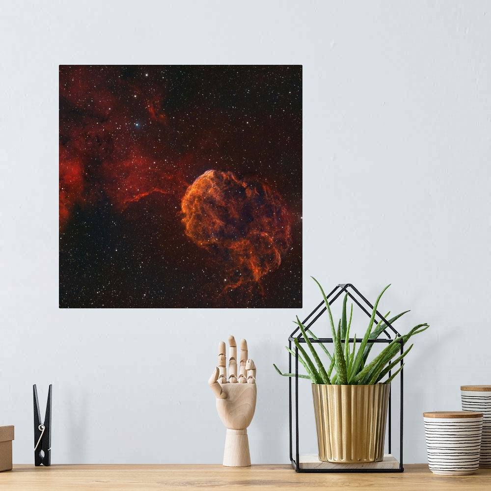 A bohemian room featuring The Jellyfish Nebula, also known as IC 443 and Sharpless 248.