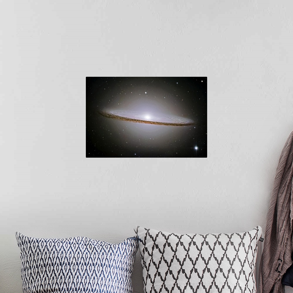 A bohemian room featuring Landscape, oversized wall hanging of the Sombrero Galaxy radiating a halo of light, surrounded by...
