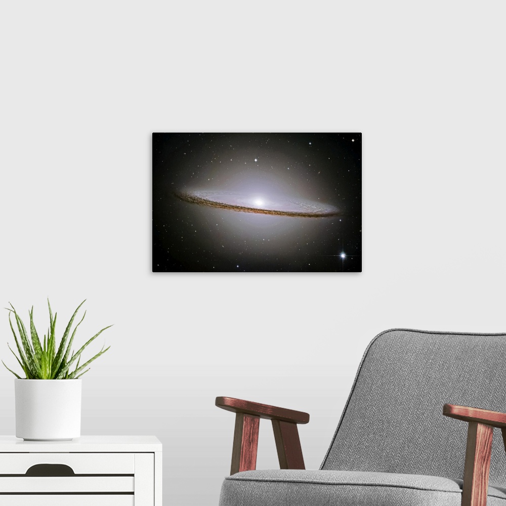 A modern room featuring Landscape, oversized wall hanging of the Sombrero Galaxy radiating a halo of light, surrounded by...