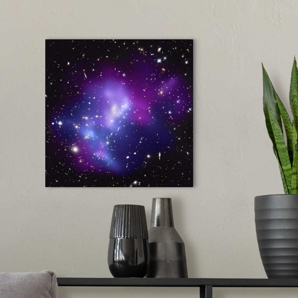 A modern room featuring Big, square wall picture of the huge galaxy cluster MACS J0717 surrounded with vibrant, multicolo...