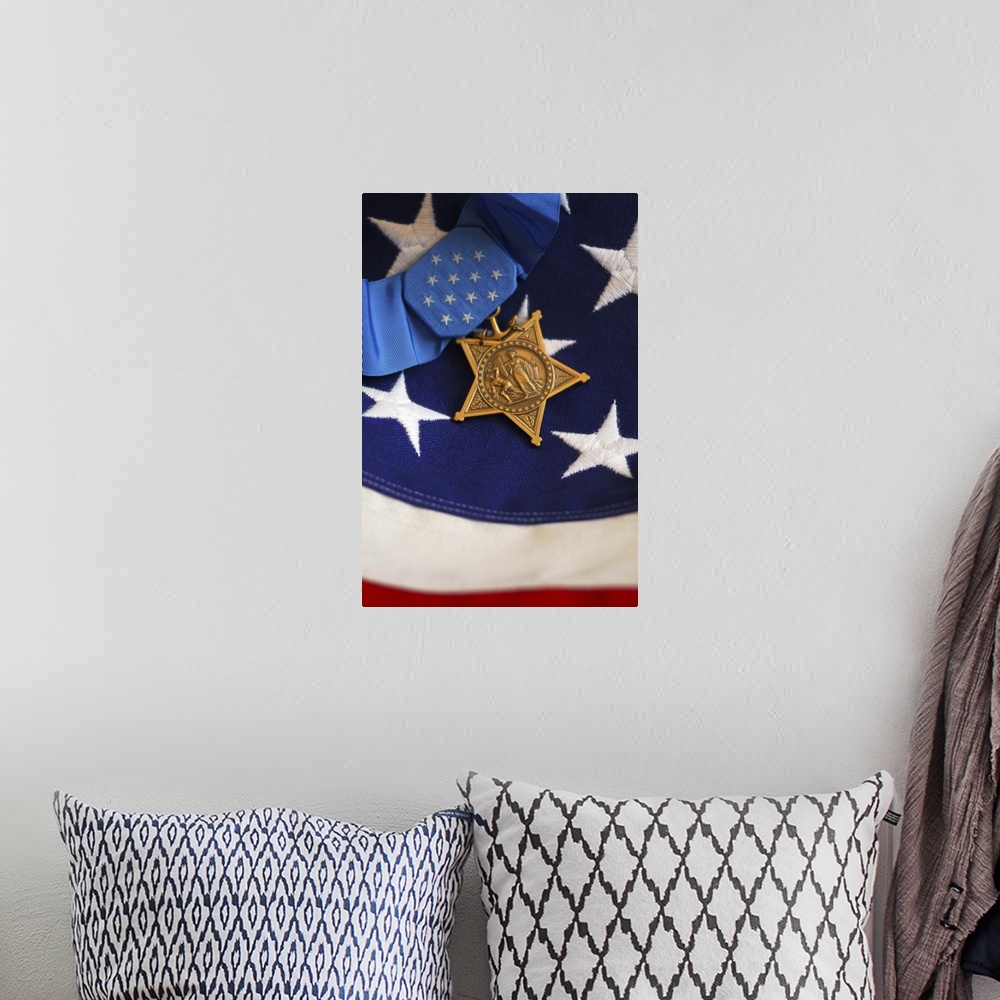 A bohemian room featuring The Medal of Honor rests on a flag during preparations for an award ceremony.