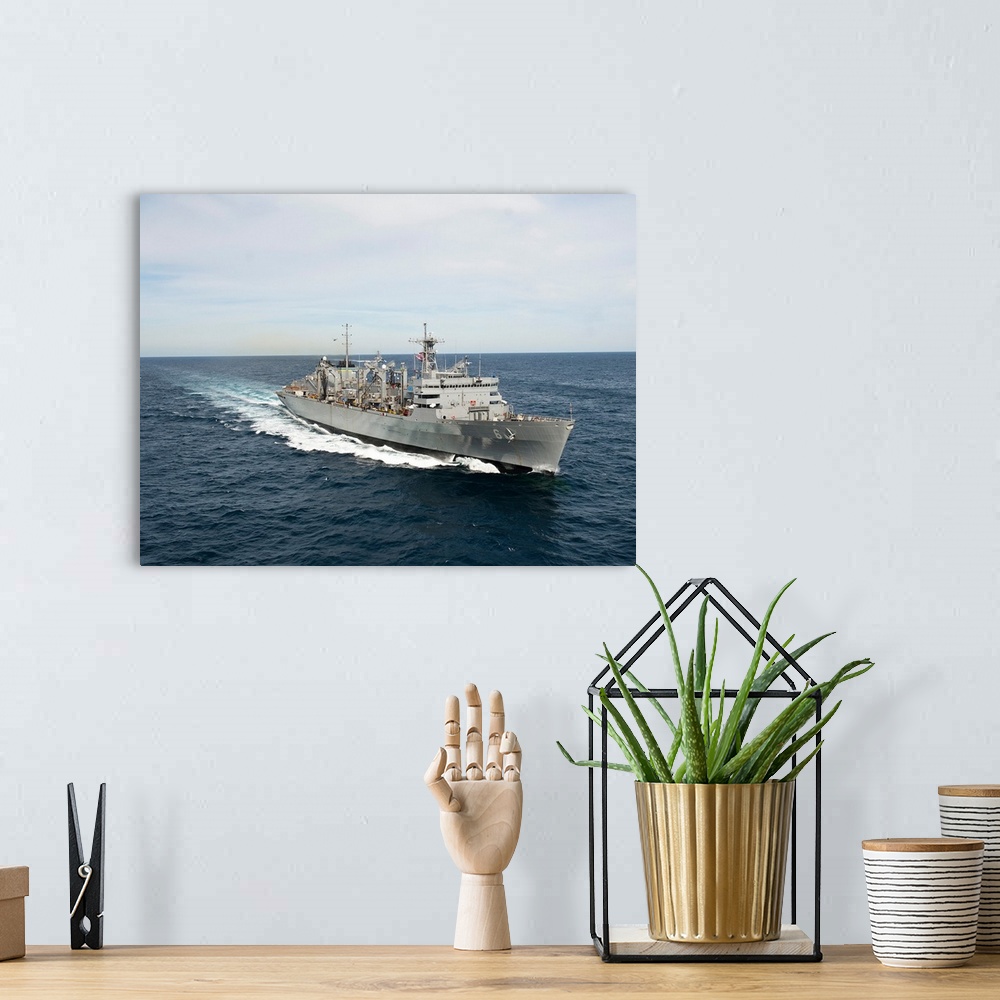 A bohemian room featuring The Military Sealift Command fast combat support ship USNS Supply.