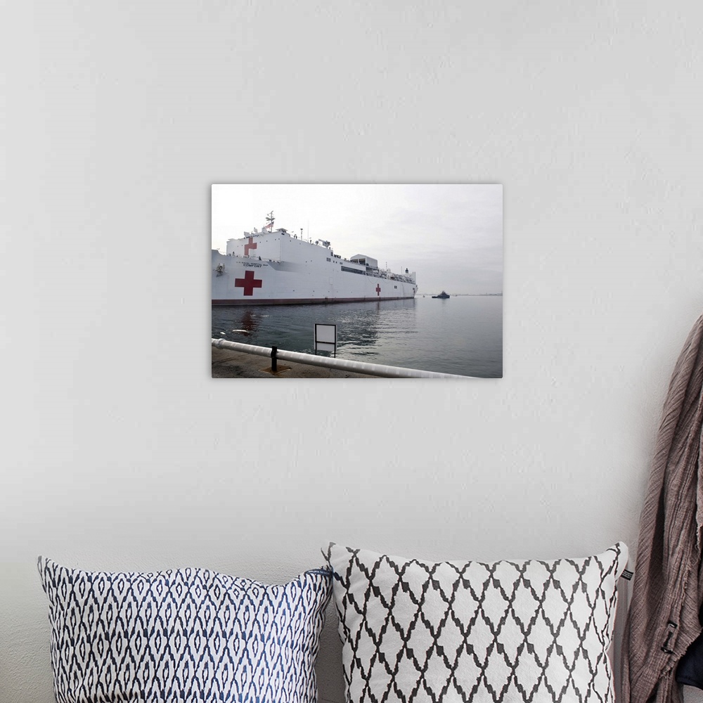 A bohemian room featuring The Military Sealift Command hospital ship USNS Comfort pulls away from Canton Pier