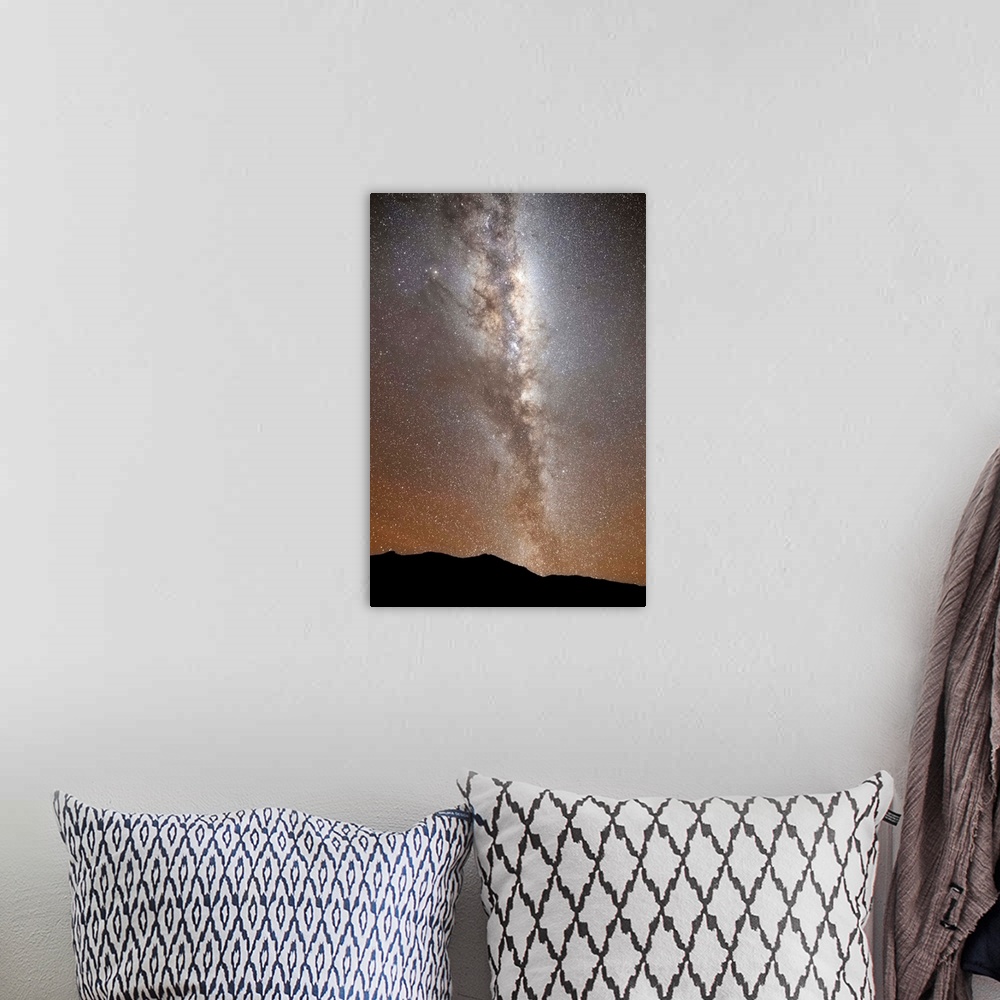 A bohemian room featuring The Milky Way in vertical position rising from the horizon, Sierra de la Ventana, Argentina.