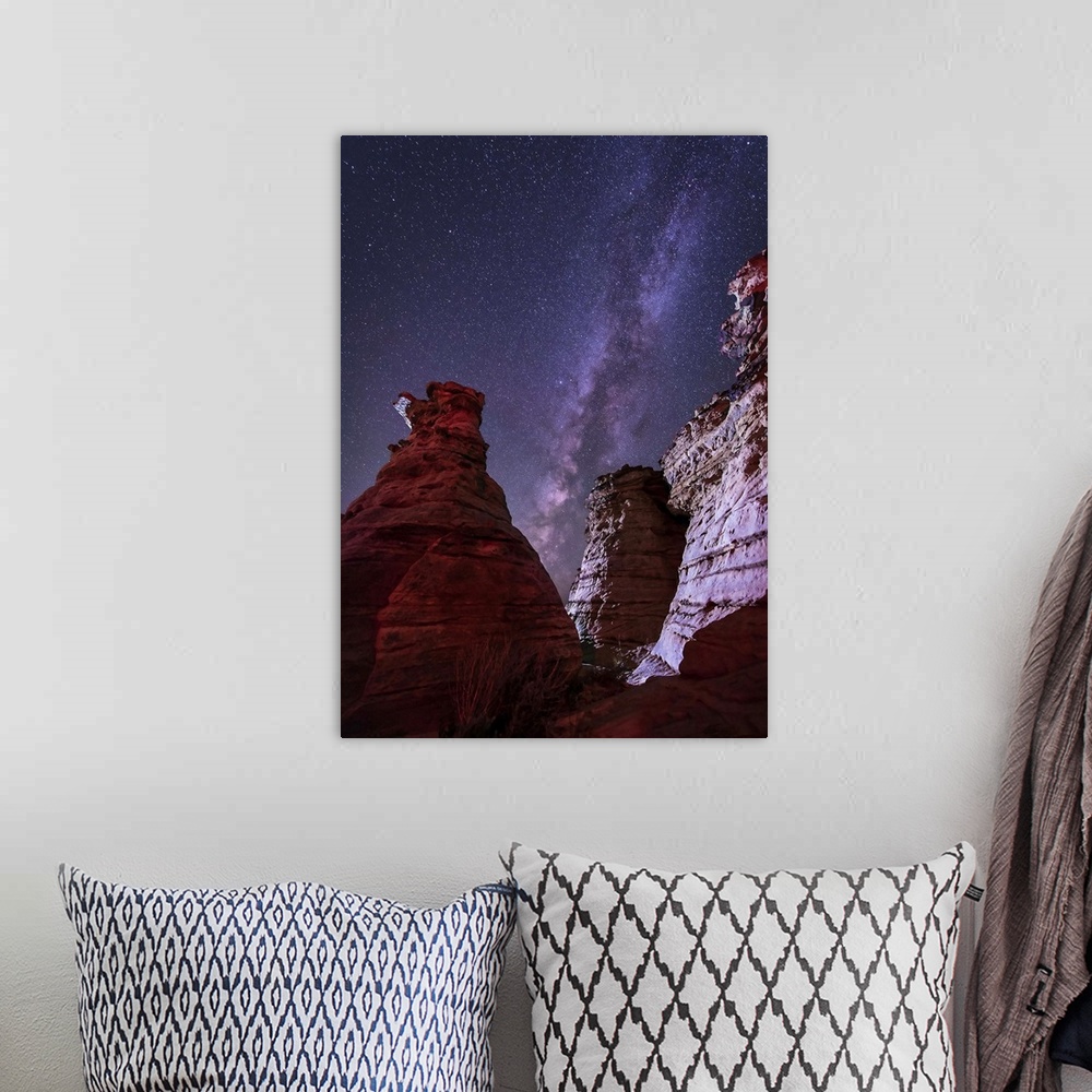 A bohemian room featuring The Milky Way rises above the Wedding Party rock formation in the Black Mesa area of Oklahoma.