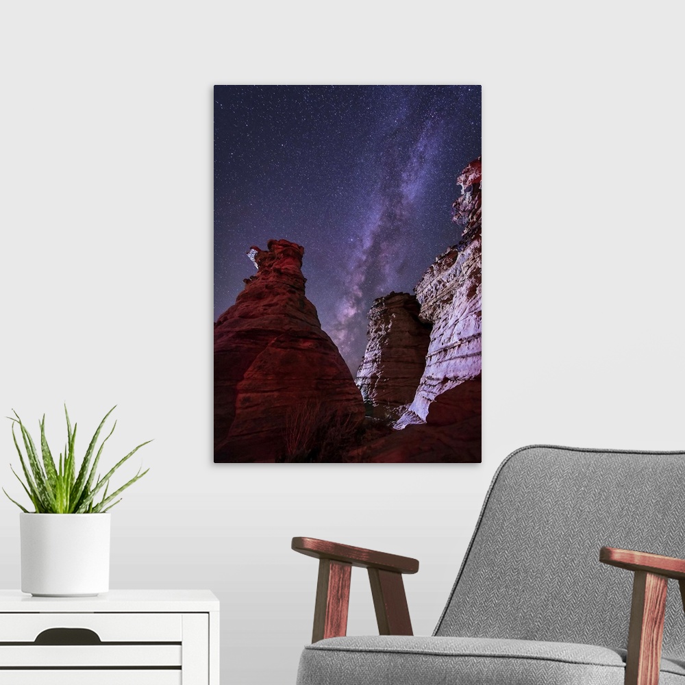 A modern room featuring The Milky Way rises above the Wedding Party rock formation in the Black Mesa area of Oklahoma.