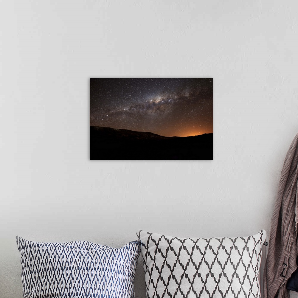 A bohemian room featuring The Milky Way setting behind the hills of Azul, Argentina, part of the Tandilia Hills. The light ...