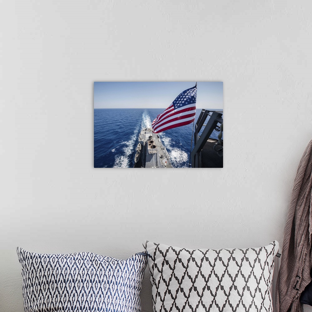 A bohemian room featuring May 23, 2013 - The national ensign flies from the mast aboard the guided-missile destroyer USS St...
