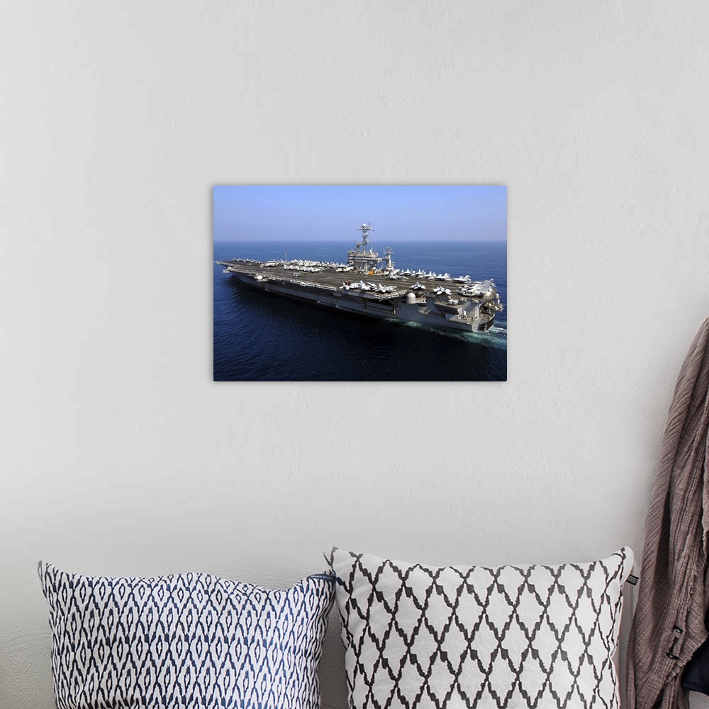 A bohemian room featuring The Nimitz-class aircraft carrier USS John C. Stennis.