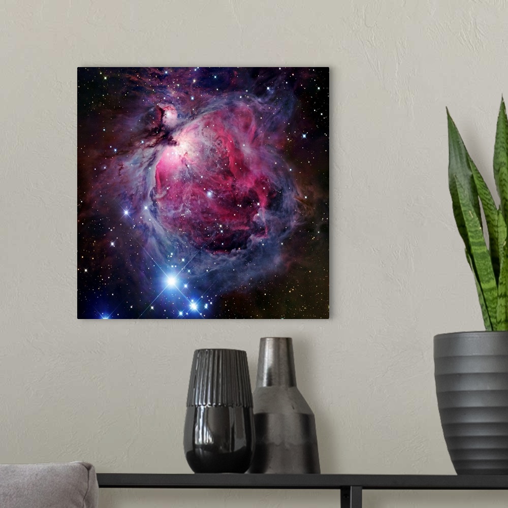 A modern room featuring The Orion Nebula, also known as Messier 42 or NGC 1976, is a diffuse nebula situated south of Ori...