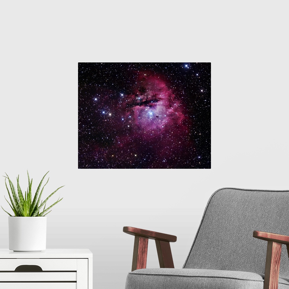 A modern room featuring The Pacman Nebula, also known as NGC 281, is an H II region in the constellation of Cassiopeia an...