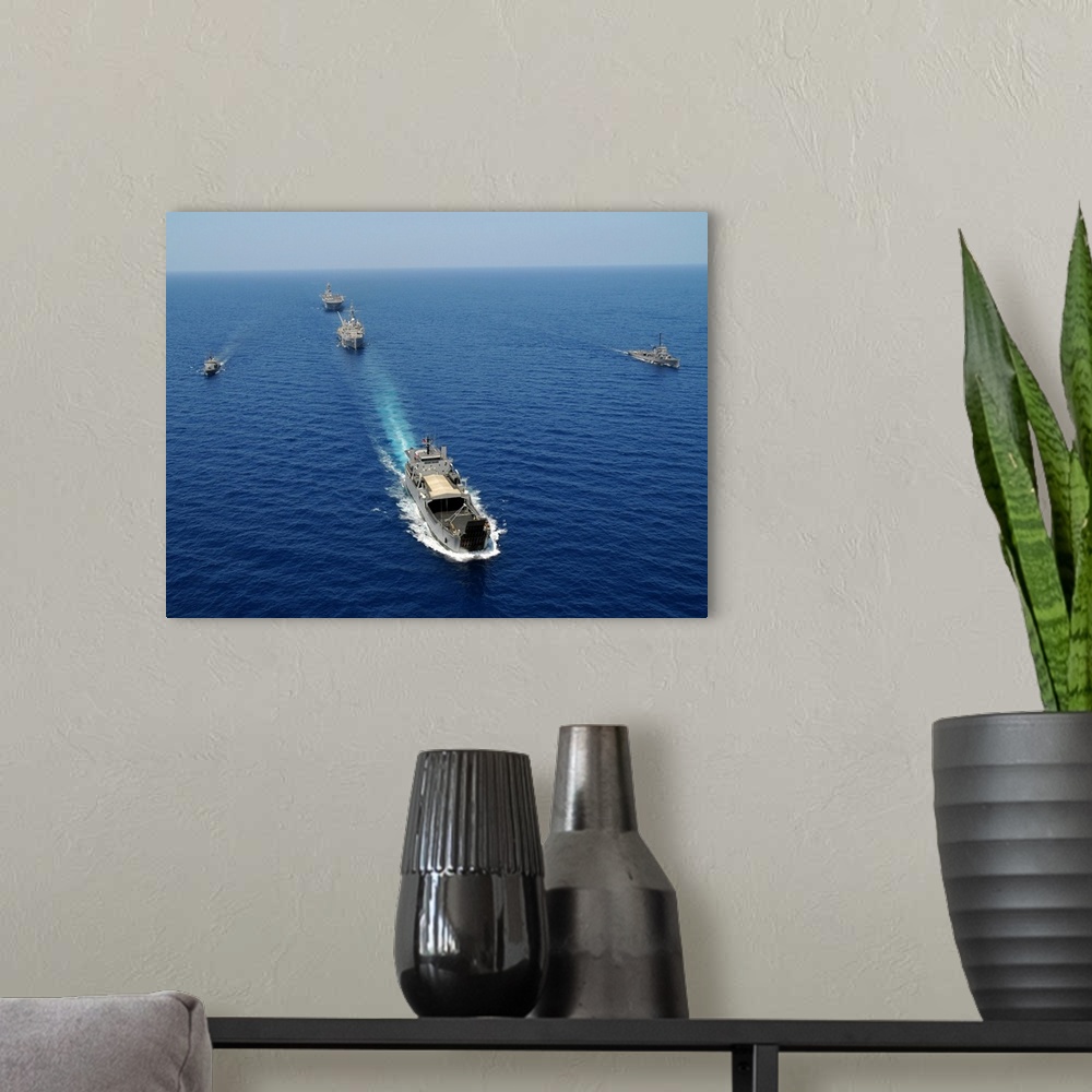 A modern room featuring The Republic of the Philippines Navy ships cruise in formation while taking part in exercise Bali...