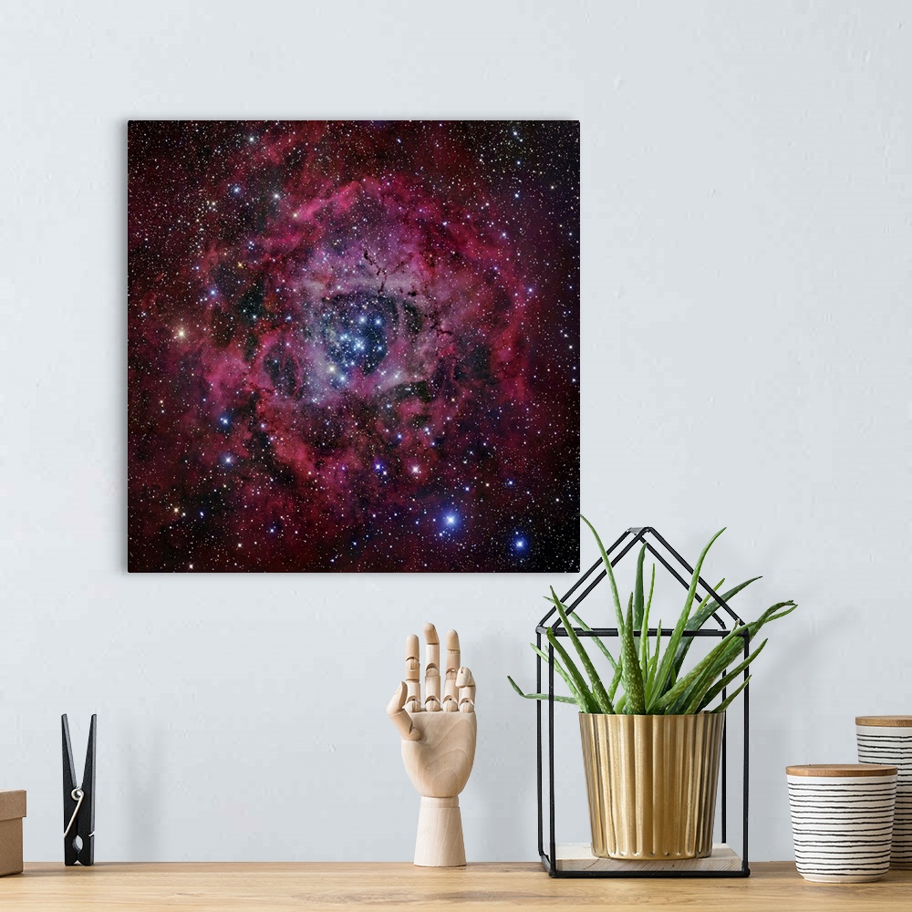 A bohemian room featuring Square, oversized wall hanging of the Rosette Nebula, surrounded by vibrant clouds and the blackn...