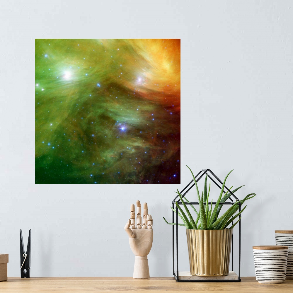 A bohemian room featuring Big square canvas art of a vividly colored solar system with stars of various sizes.