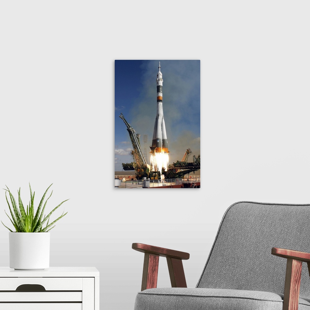 A modern room featuring The Soyuz TMA13 spacecraft launches from the Baikonur Cosmodrome in Kazakhstan