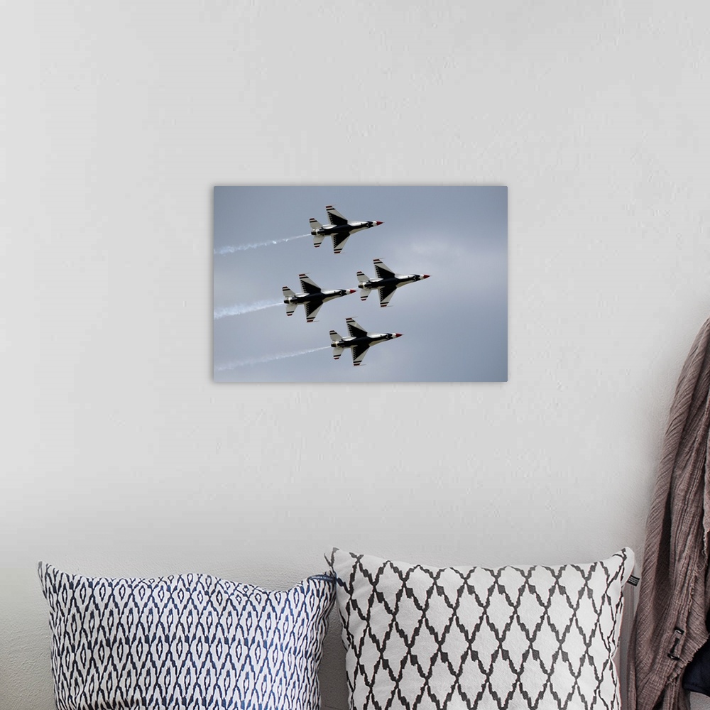 A bohemian room featuring The United States Air Force Thunderbirds demonstration squadron fly in diamond formation over Lak...