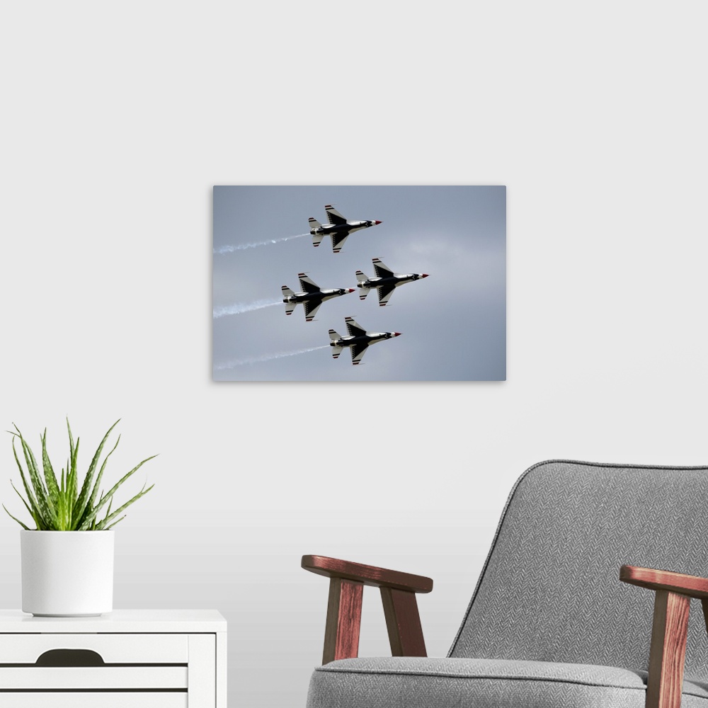 A modern room featuring The United States Air Force Thunderbirds demonstration squadron fly in diamond formation over Lak...
