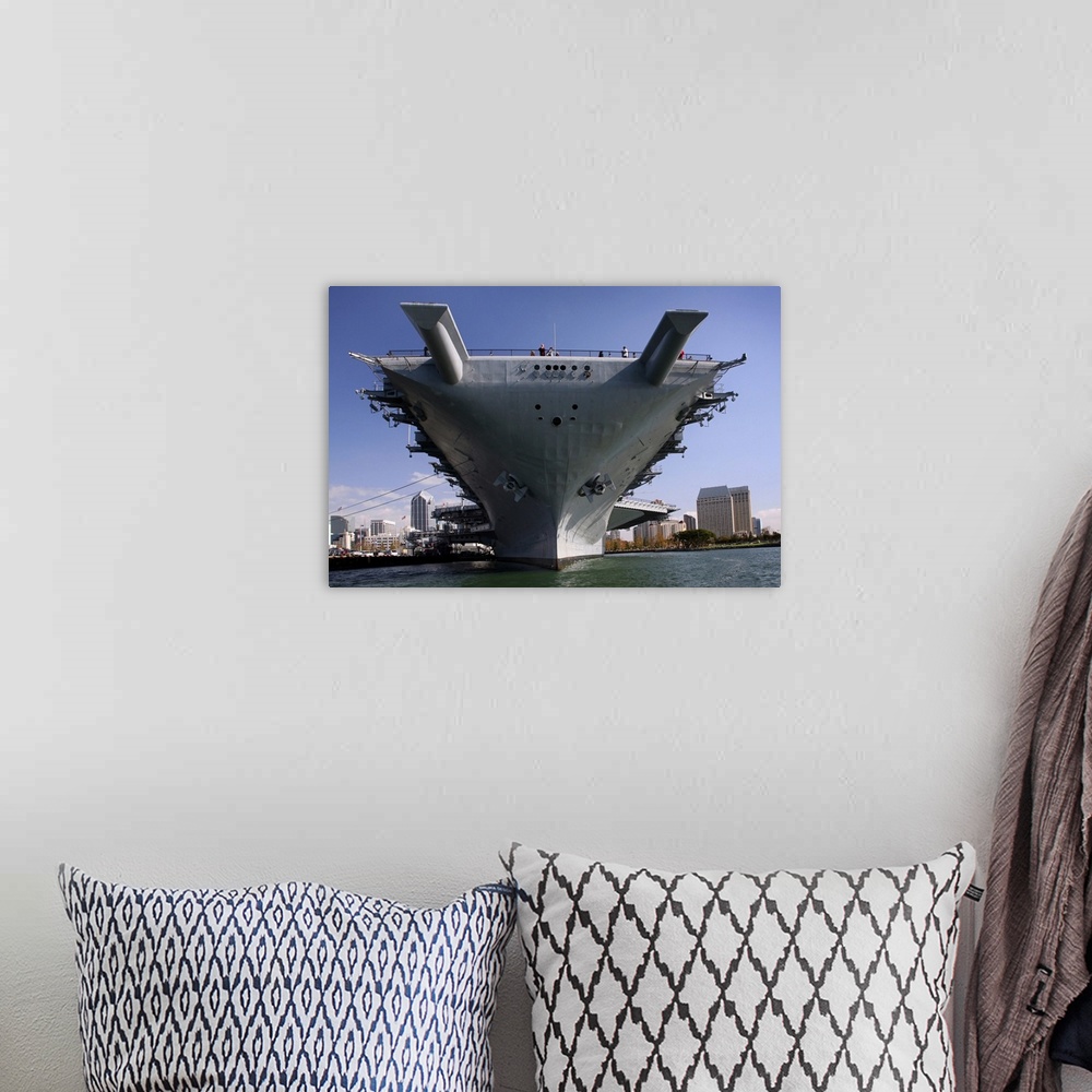 A bohemian room featuring The USS Midway berthed pierside