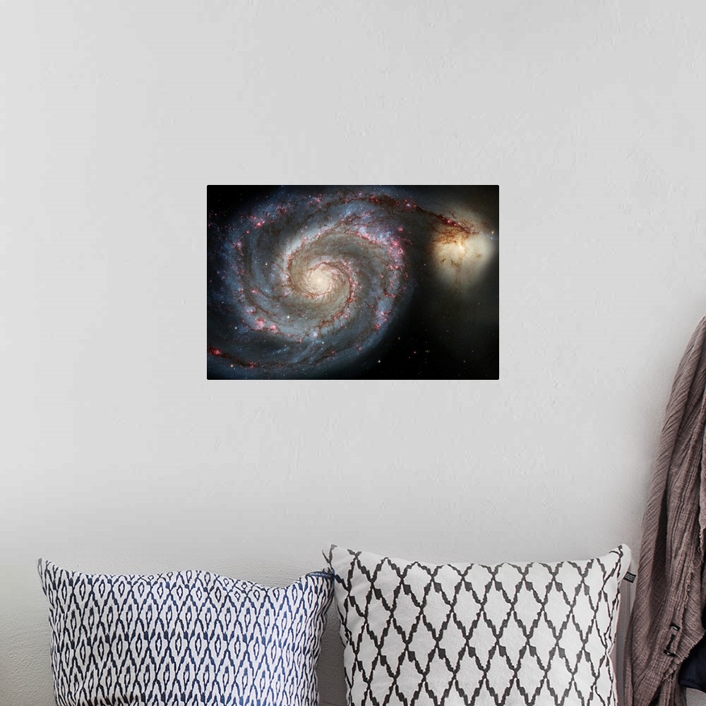 A bohemian room featuring Photograph of swirling space galaxy M51 with another galaxy in the distance.