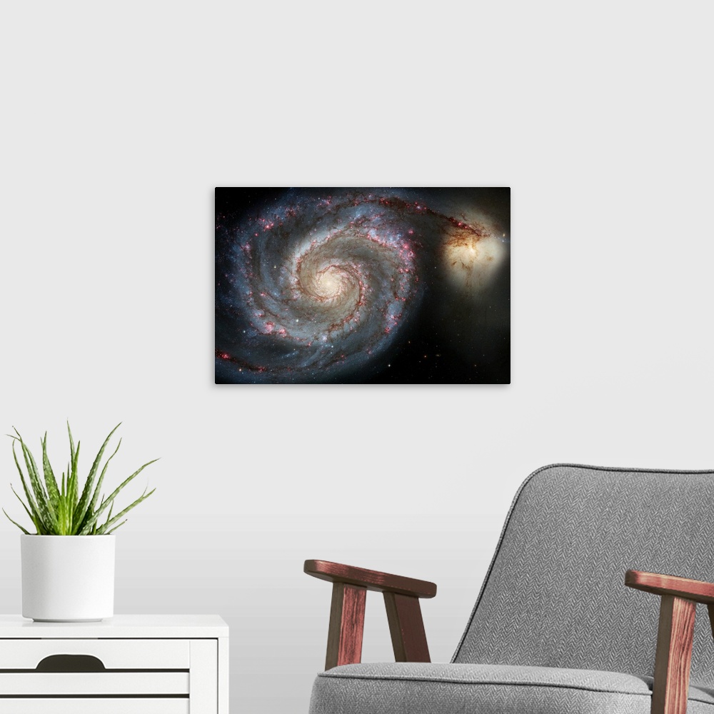A modern room featuring Photograph of swirling space galaxy M51 with another galaxy in the distance.