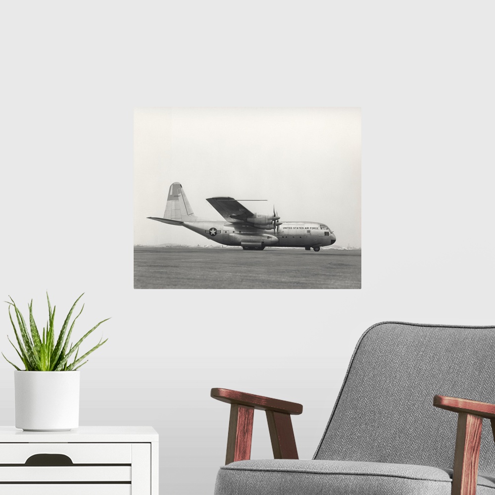 A modern room featuring August 23, 1954 - Archived photo of the YC-130 first flight from Burbank, California.