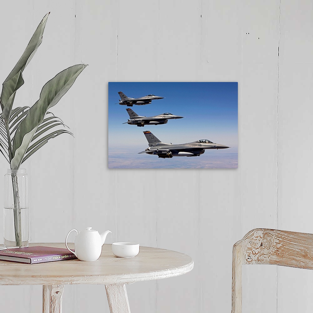 A farmhouse room featuring Three F-16's from the Air National Guard Air Force Reserve Test Center fly in formation during a ...