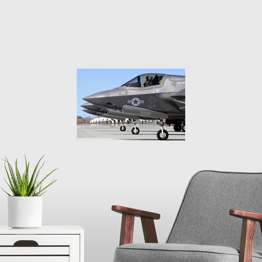 A modern room featuring Three F-35B Lightning II's at Marine Corps Air Station Yuma, Arizona.